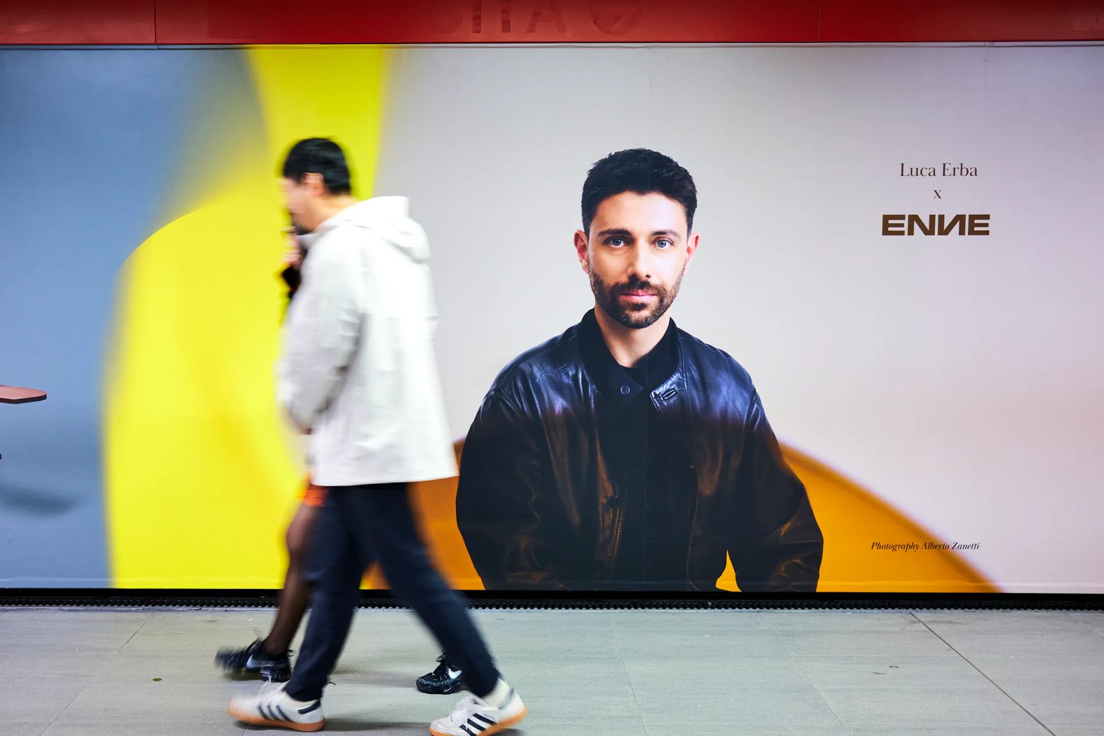 Visitor passing the Archiproducts campaign at Salone 2024