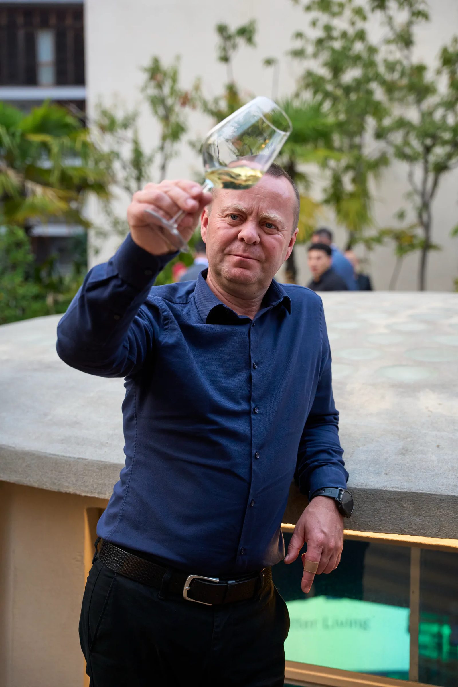 Guest raising a glass outdoors