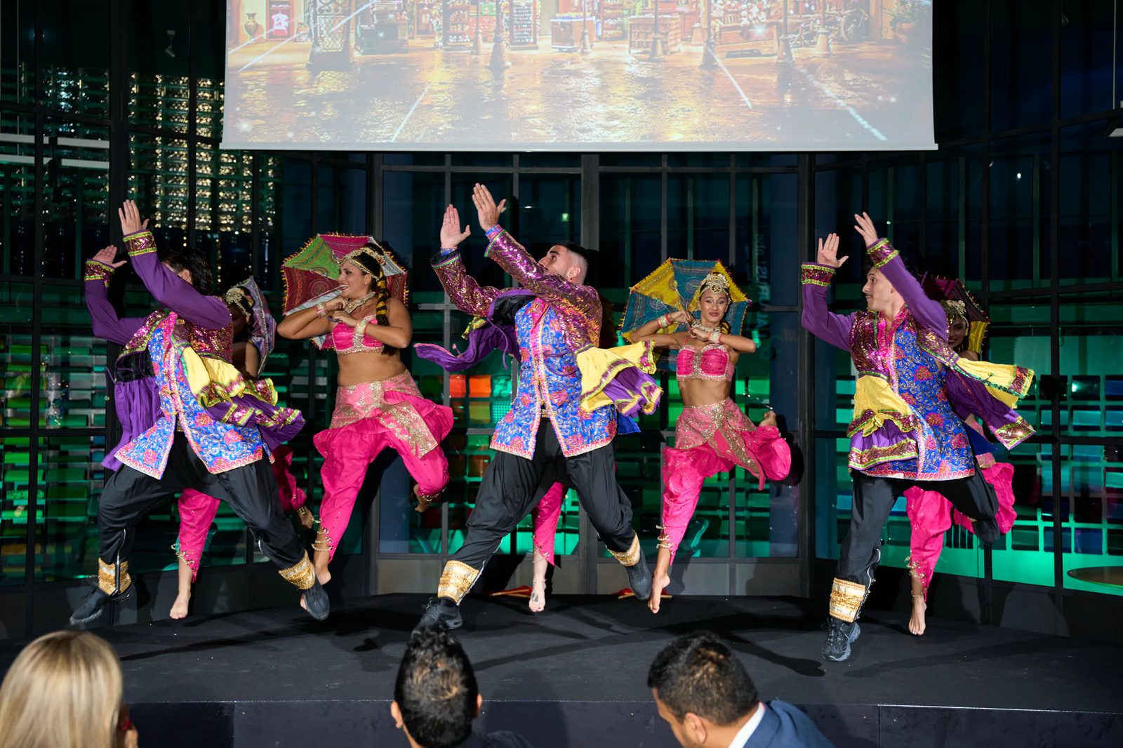 Dance group in front of the Laurus Labs projection